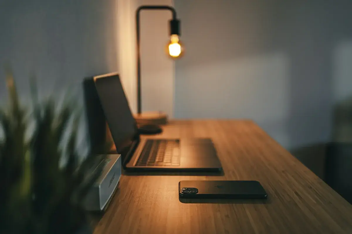 Remote workspace desk with laptop and high-floor city views, illustrative image